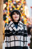Photo of young brunette , blurred background with burning garland royalty free stock images Photo of young brunette , blurred background with burning garland royalty free stock images