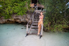 Photo Young Girl Relaxing on Beach in Bungalow Close. Smiling Woman Spending Chill Time Outdoor Summer. Caribbean Ocean Stock Images Photo Young Girl Relaxing on Beach in Bungalow Close. Smiling Woman Spending Chill Time Outdoor Summer. Caribbean Ocean Stock Images
