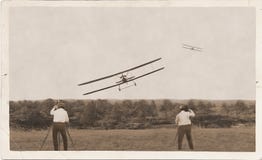 Photographers, old planes racing. Winner landing.
