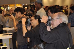 Photographers photograph a female model posing for photographers stock photos Photographers photograph a female model posing for photographers stock photos