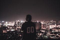 Photography of a Person Watching over City Lights during Night Time Royalty Free Stock Image Photography of a Person Watching over City Lights during Night Time Royalty Free Stock Image