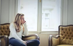 Photography of Woman Sitting on Chair Near Window Royalty Free Stock Photo Photography of Woman Sitting on Chair Near Window Royalty Free Stock Photo