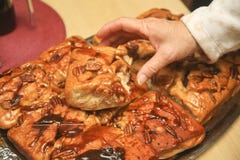 Picking up Sticky Bun Royalty Free Stock Image Picking up Sticky Bun Royalty Free Stock Image