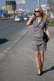 Woman in grey dress outdoors Stock Image Woman in grey dress outdoors Stock Image