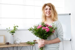 Picture of florist girl making up bouquet