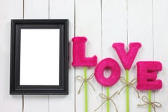 Picture frames and red letters of love are placed stock photo Picture frames and red letters of love are placed stock photo