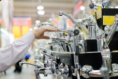 Picture Of Business Man Or Woman Choosing And Touching Faucet Crane Or Water Tap On Shopping Shelf Display Of DIY Department Store Stock Photography Picture Of Business Man Or Woman Choosing And Touching Faucet Crane Or Water Tap On Shopping Shelf Display Of DIY Department Store Stock Photography