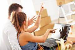 Happy adult couple moving out or in to new home Royalty Free Stock Photos Happy adult couple moving out or in to new home Royalty Free Stock Photos