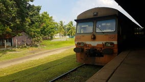 Incoming train on train station in Sri Lanka stock photo Incoming train on train station in Sri Lanka stock photo