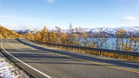 Beautiful September landscape on the snowy shores of a calm northern fjord in Norway. royalty free stock photo Beautiful September landscape on the snowy shores of a calm northern fjord in Norway. royalty free stock photo