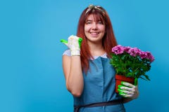 Picture of woman with chrysanthemum pointing finger at side