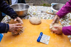 Kneading bread as part of an outdoor bread making workshop stock image Kneading bread as part of an outdoor bread making workshop stock image