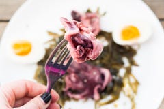 Piece of octopus on the folk closeup Stock Image Piece of octopus on the folk closeup Stock Image