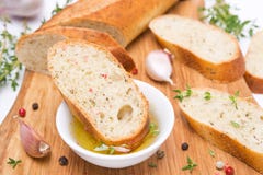 Piece Of Baguette In A Fragrant Olive Oil, Spices, Garlic Royalty Free Stock Photography