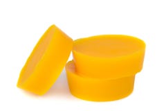 Pieces of natural beeswax are on a white background. Beekeeping products. Apitherapy. royalty free stock images Pieces of natural beeswax are on a white background. Beekeeping products. Apitherapy. royalty free stock images