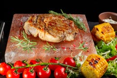 Pieces of roast beef with spices served on black slate. stock image Pieces of roast beef with spices served on black slate. stock image