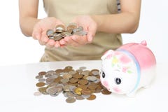 Piggy bank with coins Stock Images Piggy bank with coins Stock Images