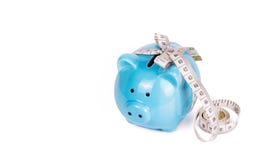 Piggy bank and measuring tape. Concept diet. Concept savings. Copy space. royalty free stock image Piggy bank and measuring tape. Concept diet. Concept savings. Copy space. royalty free stock image