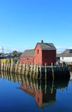 Pijler met rode die visserijkeet als Motiefaantal in Rockport wordt bekend stock fotografie Pijler met rode die visserijkeet als Motiefaantal in Rockport wordt bekend stock fotografie