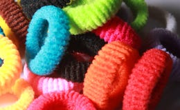 A pile of colorful elastic hair bands with side lighting. Royalty Free Stock Photo A pile of colorful elastic hair bands with side lighting. Royalty Free Stock Photo