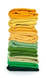 Pile of green and yellow folded clothes royalty free stock photography Pile of green and yellow folded clothes royalty free stock photography