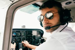 Pilot In Sunglasses And Headset Looking At Camera Royalty Free Stock Photo