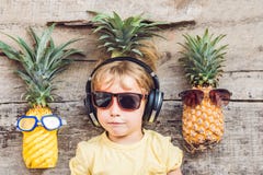 A pineapple boy and pineapples on vacation royalty free stock image A pineapple boy and pineapples on vacation royalty free stock image