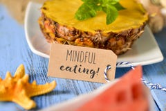 Pineapple, watermelon and text mindful eating royalty free stock photo Pineapple, watermelon and text mindful eating royalty free stock photo