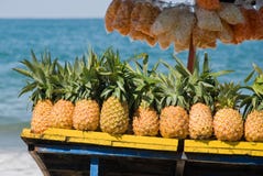 Pineapples for sale on tropical beach