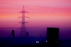 Pink dawn sky. Dark silhouettes of cars on the highway. stock photos Pink dawn sky. Dark silhouettes of cars on the highway. stock photos