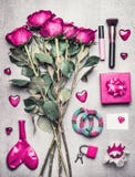 Pink Female accessories with roses flowers, makeup , hearts. Top view on messy woman boudoir , fashion blogger or modern dating royalty free stock image Pink Female accessories with roses flowers, makeup , hearts. Top view on messy woman boudoir , fashion blogger or modern dating royalty free stock image