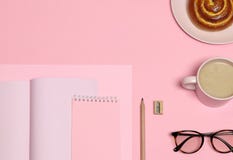 Pink notes paper, wooden pencil, sharpener, coffee cup, cake on pink background stock image Pink notes paper, wooden pencil, sharpener, coffee cup, cake on pink background stock image
