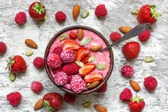 Pink Raspberries And Strawberry Fruit Smoothie Or Milk Shake In A Bowl With Berries, Nuts And Seeds Stock Images