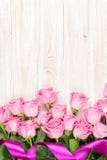 Pink roses bouquet over wooden table stock photos Pink roses bouquet over wooden table stock photos