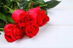 Pink roses on a white wooden table. Copy space for text. Template for March 8, Mother\'s Day, Valentine\'s Day. Pink roses on a white wooden table. Copy space Stock Photos Pink roses on a white wooden table. Copy space for text. Template for March 8, Mother\'s Day, Valentine\'s Day. Pink roses on a white wooden table. Copy space Stock Photos