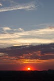 The pink sun sets over the city skyline stock photography The pink sun sets over the city skyline stock photography