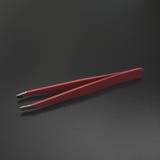Pink tweezers gray background royalty free stock images Pink tweezers gray background royalty free stock images