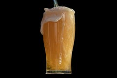 Pint of fresh beer being poured up and overfilled with white foam and bubbles running down the side of the glass royalty free stock photos Pint of fresh beer being poured up and overfilled with white foam and bubbles running down the side of the glass royalty free stock photos