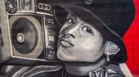 Pintada del arte de la calle de un muchacho que escucha la música libre illustration Pintada del arte de la calle de un muchacho que escucha la música libre illustration