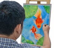 Pintura masculina joven de los pescados de la acuarela del dibujo del artista imagen de archivo Pintura masculina joven de los pescados de la acuarela del dibujo del artista imagen de archivo