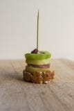 Pintxos Pintxo, Raisin, kiwi, potato, paté and bread on a Rustic Board, food from the Basque Country stock photography Pintxos Pintxo, Raisin, kiwi, potato, paté and bread on a Rustic Board, food from the Basque Country stock photography