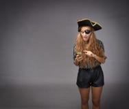 Pirate communication with smartphone stock photo Pirate communication with smartphone stock photo