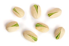 Pistacchi isolati su fondo bianco, vista superiore Disposizione piana fotografie stock Pistacchi isolati su fondo bianco, vista superiore Disposizione piana fotografie stock
