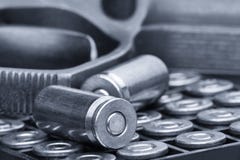 Pistol and bullets close-up on white background. The concept of limiting the spread of small arms. Toned image stock images Pistol and bullets close-up on white background. The concept of limiting the spread of small arms. Toned image stock images