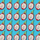 Pitaya fruit slices pattern on vibrant turquoise background Stock Images Pitaya fruit slices pattern on vibrant turquoise background Stock Images