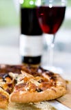 Pizza slice and wine