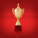 Plan rapproché d'un trophée d'or brillant, sur le rouge image libre de droits Plan rapproché d'un trophée d'or brillant, sur le rouge image libre de droits