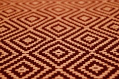 Plan rapproché de tissu ethnique de couleur brune orange et foncé de modèle images libres de droits Plan rapproché de tissu ethnique de couleur brune orange et foncé de modèle images libres de droits