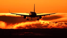 Plane spotting at Otopeni airport during sunset with red sky Royalty Free Stock Image Plane spotting at Otopeni airport during sunset with red sky Royalty Free Stock Image