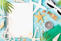 Planning summer holidays, trip, travel and vacation background. Open notebook with accessories on blue table top view. Flat lay royalty free stock images Planning summer holidays, trip, travel and vacation background. Open notebook with accessories on blue table top view. Flat lay royalty free stock images